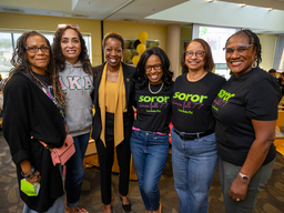 5 sorority alumni standing with UMBC president at homecoming social
