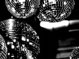 a black and white image of disco balls.