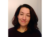 Ivona Cetinic, woman with black hair wears a black sweater.
