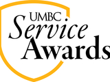 An outline of the UMBC shield with the text "UMBC Service Awards"